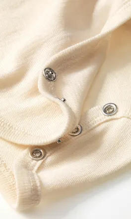 Wrap-over press studs detail
